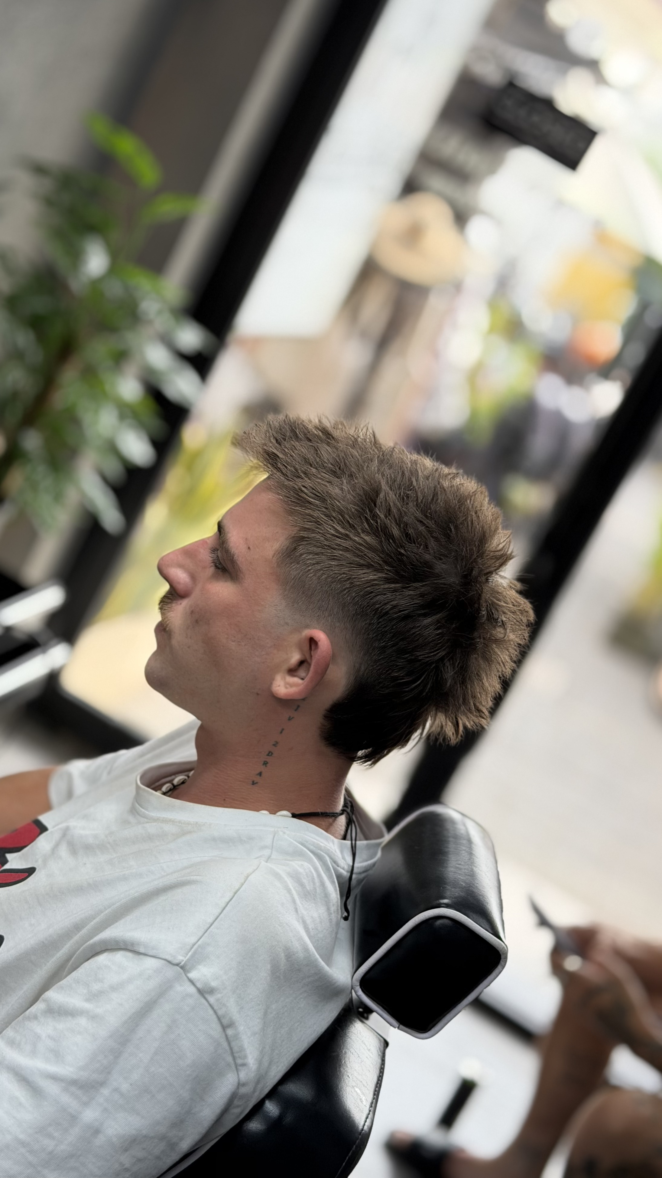 Modern mullet haircut by Triple Line Barbershop