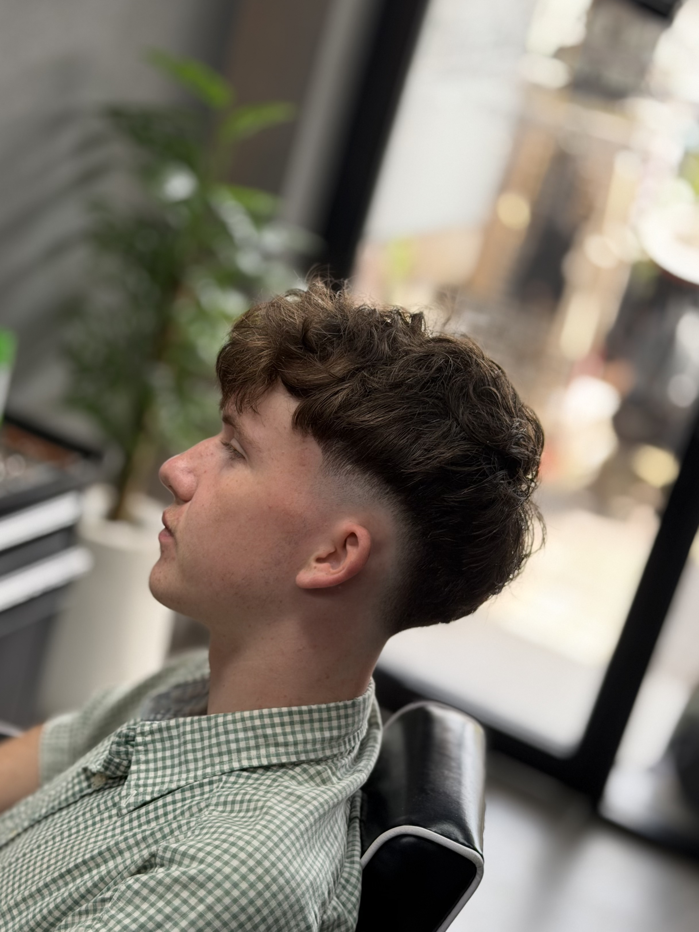Taper design haircut by Triple Line Barbershop